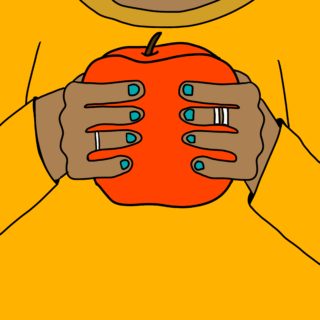 Hands with blue nail polish holding a red apple