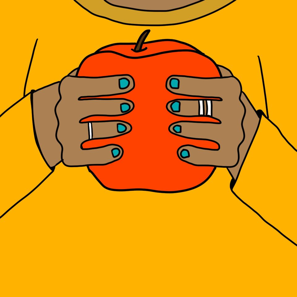 Hands with blue nail polish holding a red apple