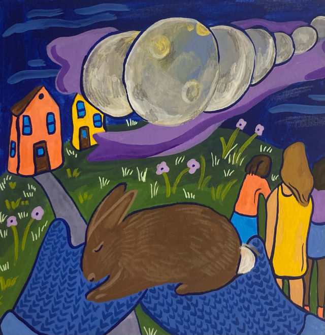 Illustration of a brown rabbit held in blue mittens. Some colorful houses, people, and the phases of the moon across the night sky in the background.